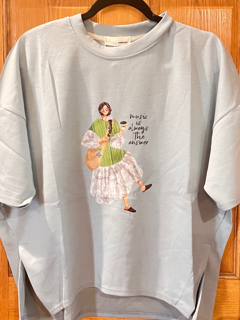 Light Blue Graphic Tee with Whimsical Music Illustration